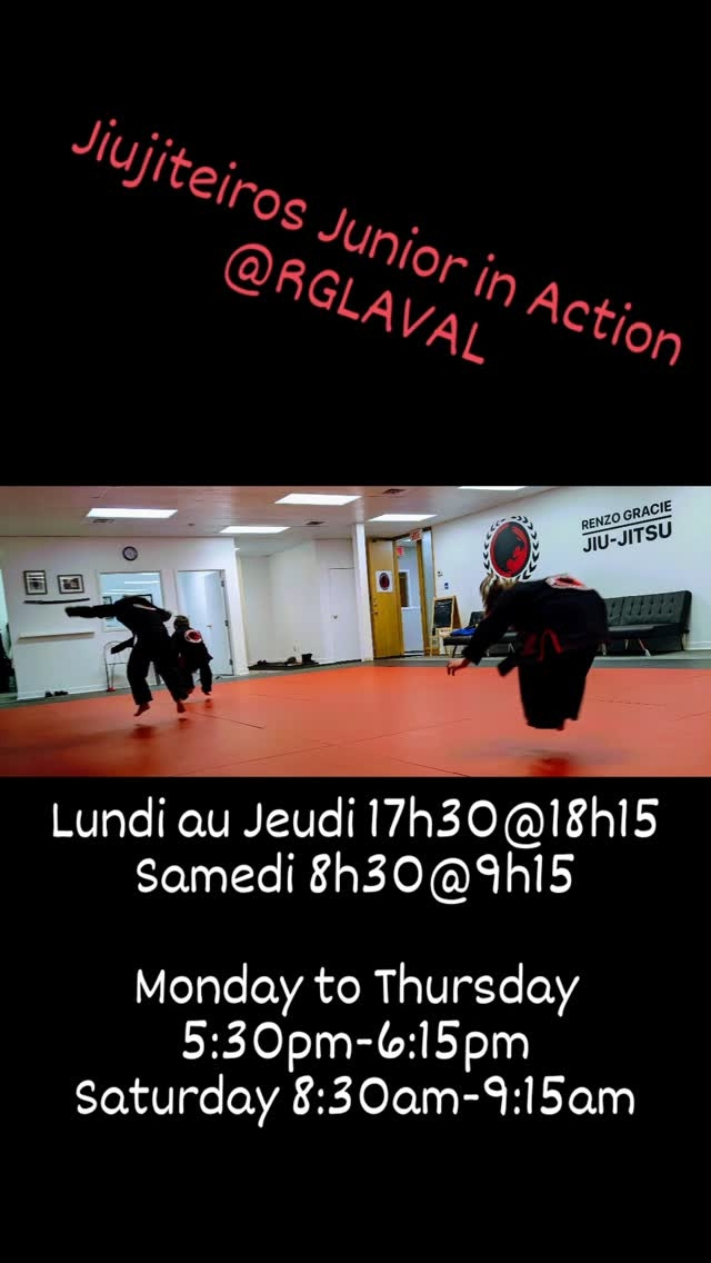 Young students in black gis practise a throw on red mats under a title