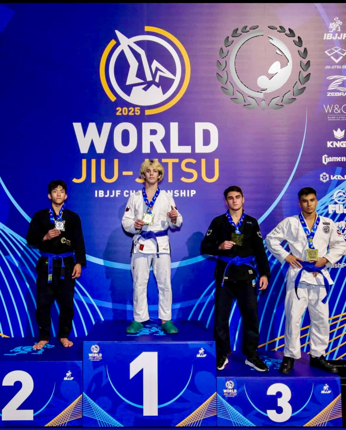 Four medalists in gis on the 2025 World Jiu-Jitsu podium