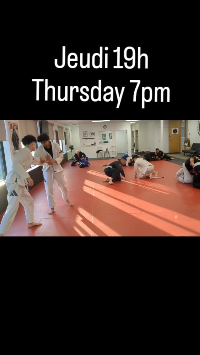 Pairs in gis drill on red mats under the words Thursday 7pm